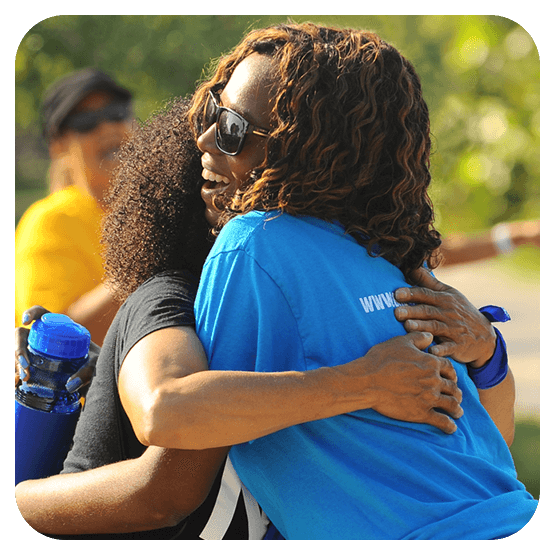 Image of two black woman hugging